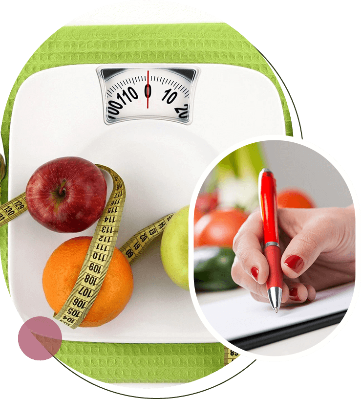 A person is writing on the scale with fruits and vegetables.